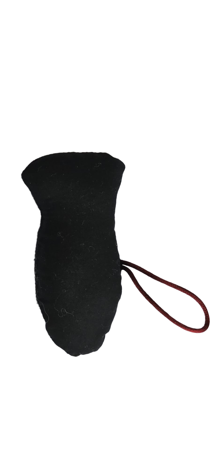 Black textured object with a red string on a white background