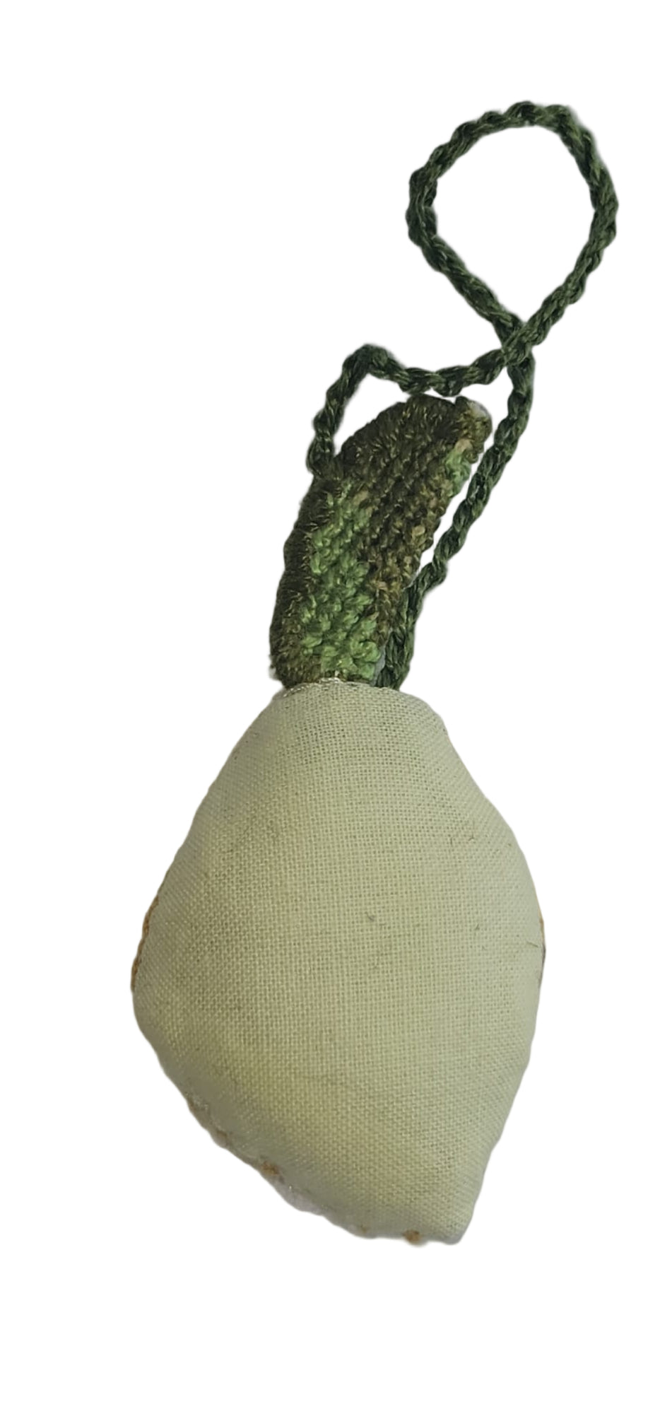 Textured green and beige object with a rope on a gray background