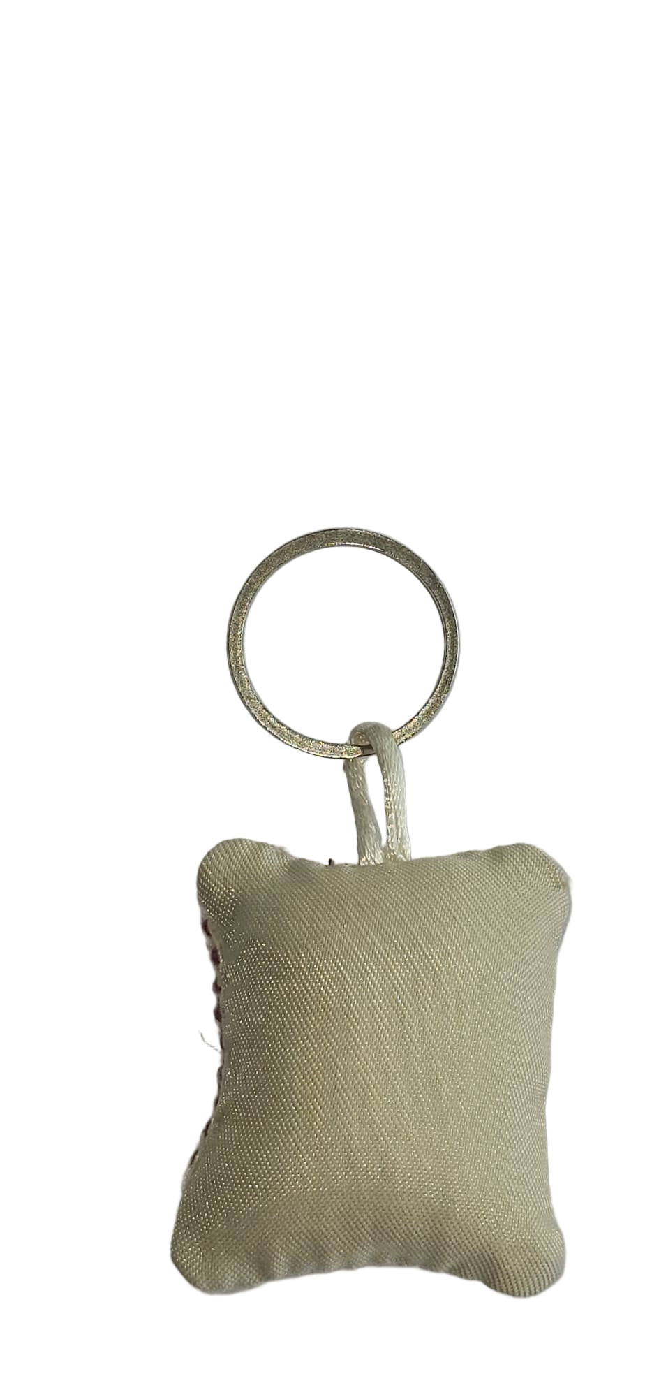 Beige fabric keychain with a ring on a light gray background